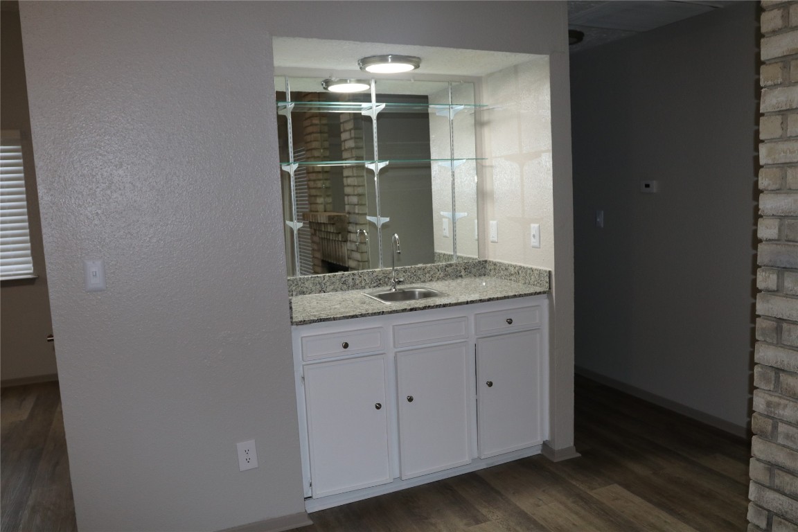 11530 Ridge Run Drive Houston, TX 77064 - Photo 17 of 38 a bathroom with a granite countertop sink and a mirror