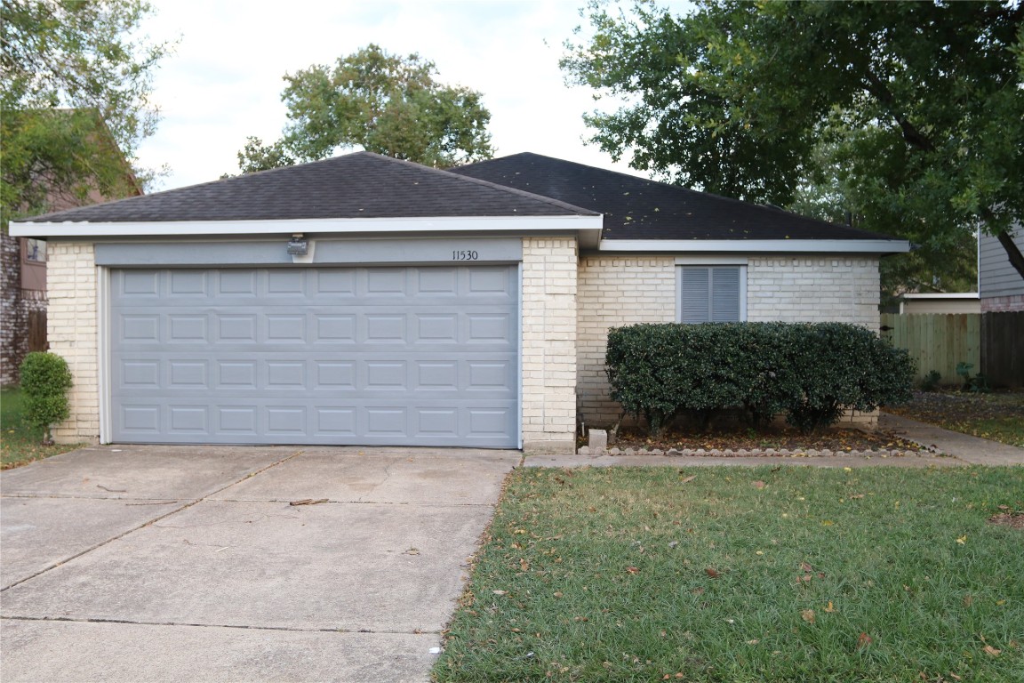 11530 Ridge Run Drive Houston, TX 77064 - Photo 2 of 38 a front view of house with yard and trees in the background