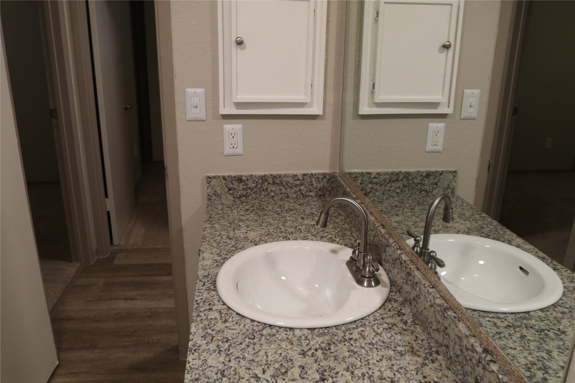 11530 Ridge Run Drive Houston, TX 77064 - Photo 22 of 38 a bathroom with a sink and a mirror