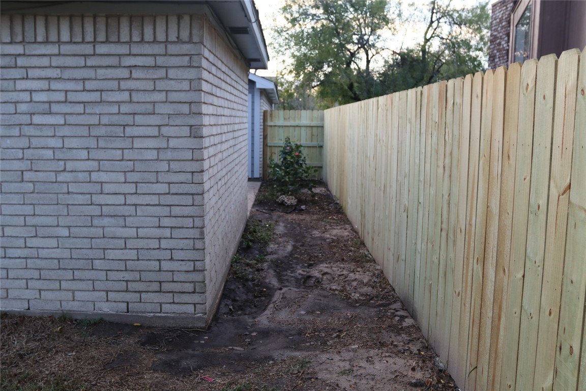 11530 Ridge Run Drive Houston, TX 77064 - Photo 34 of 38 a view of a pathway with a wooden fence