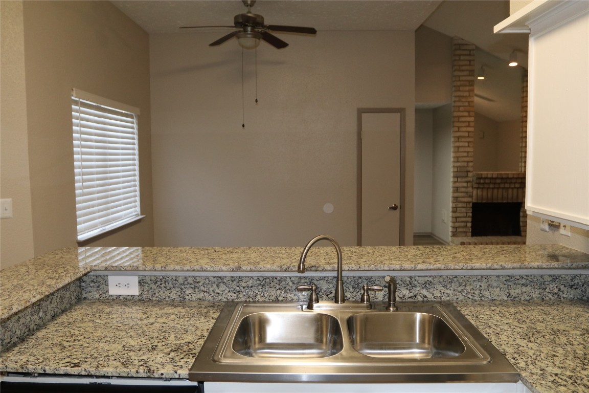 11530 Ridge Run Drive Houston, TX 77064 - Photo 9 of 38 a kitchen with a sink and a mirror