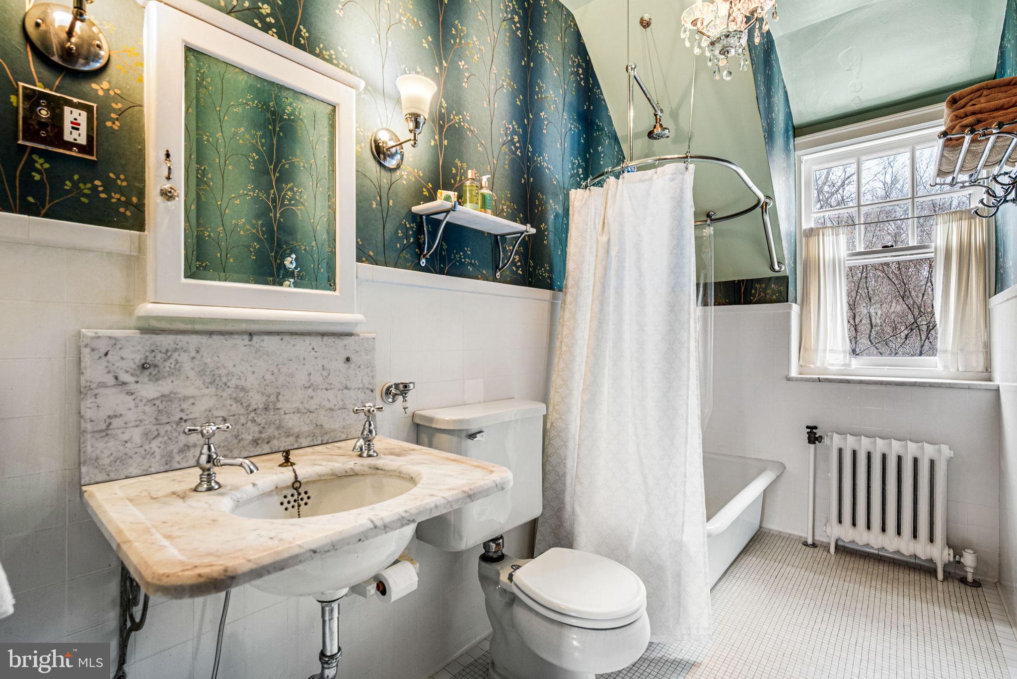 1018 Beech Road Wallingford, PA 19086 - Photo 36 of 66 a bathroom with a sink a toilet and shower