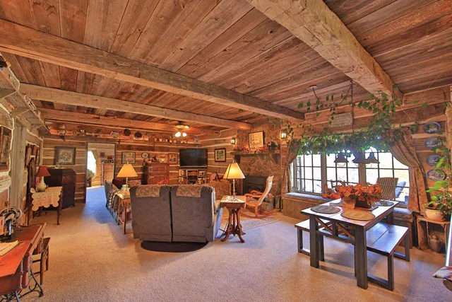 a view of a chairs and table in a room