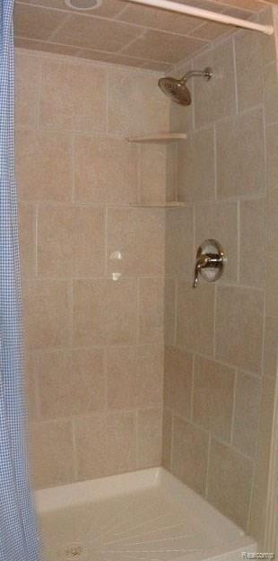 2478 Pembroke Road Birmingham, MI 48009 - Photo 38 of 38 Lower level full bath offers neutral ceramic tile & paint, ceramic stall shower, & pedestal sink