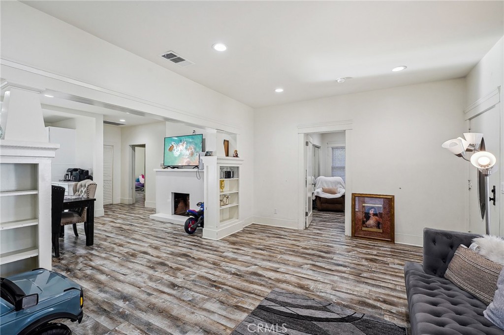 7251 Painter Avenue, Unit 7255 Whittier, CA 90602 - Photo 14 of 56 a living room with furniture and a fireplace