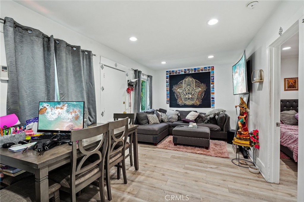 7251 Painter Avenue, Unit 7255 Whittier, CA 90602 - Photo 21 of 56 a living room with furniture a rug and a wall painting