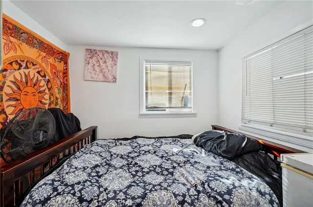 a bedroom with a bed and cabinets