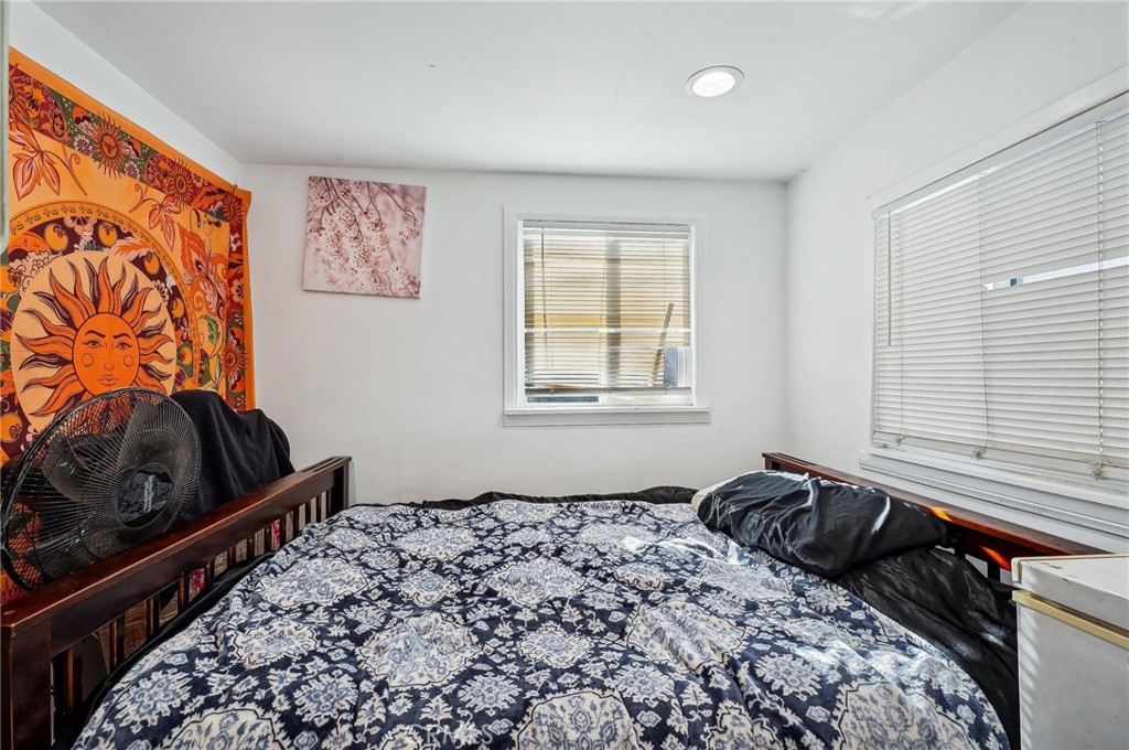 7251 Painter Avenue, Unit 7255 Whittier, CA 90602 - Photo 25 of 56 a bedroom with a bed and a window