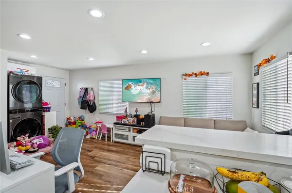 a bedroom with a bed and a couch