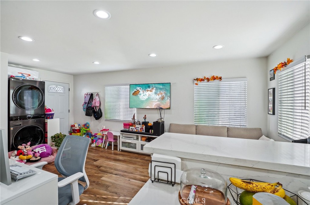 7251 Painter Avenue, Unit 7255 Whittier, CA 90602 - Photo 26 of 56 a living room with furniture a flat screen tv and a window