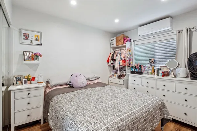 a bedroom with a bed and a fish tank