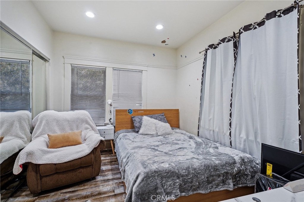 7251 Painter Avenue, Unit 7255 Whittier, CA 90602 - Photo 29 of 56 a bedroom with a bed and a couch