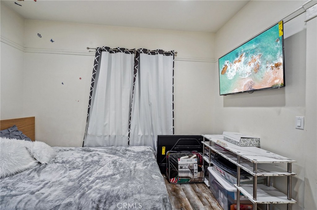 7251 Painter Avenue, Unit 7255 Whittier, CA 90602 - Photo 30 of 56 a bedroom with a bed and a fish tank