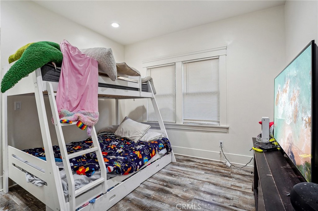 7251 Painter Avenue, Unit 7255 Whittier, CA 90602 - Photo 31 of 56 a bedroom with a bed and a window