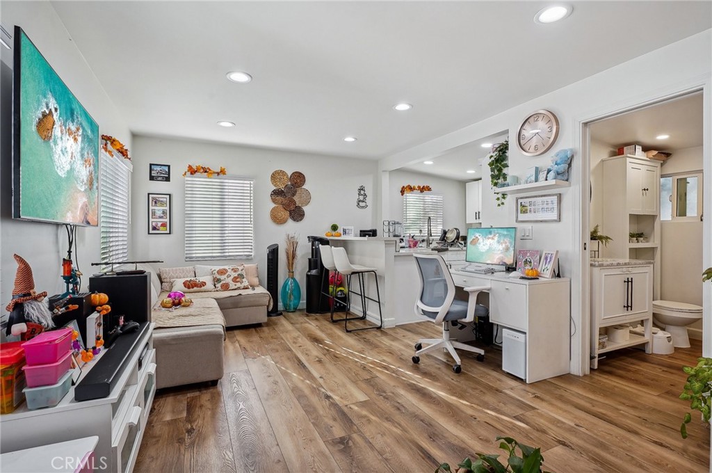 7251 Painter Avenue, Unit 7255 Whittier, CA 90602 - Photo 34 of 56 a living room with furniture and wooden floor