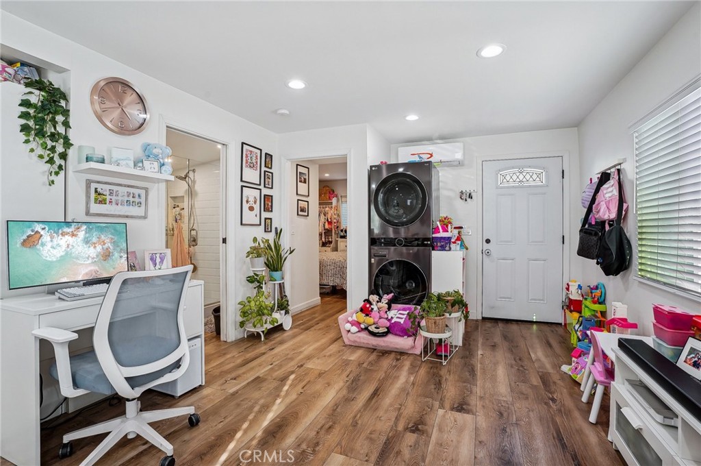 7251 Painter Avenue, Unit 7255 Whittier, CA 90602 - Photo 35 of 56 a living room with furniture and a flat screen tv