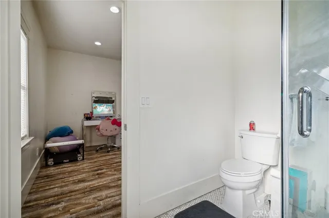 a bathroom with a double vanity sink mirror and shower