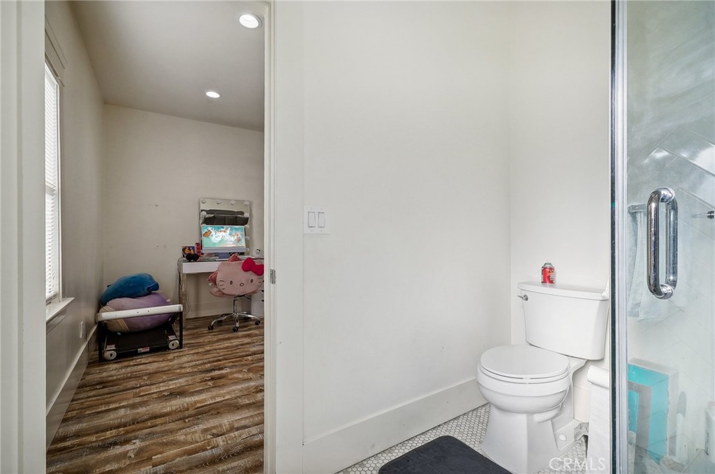 7251 Painter Avenue, Unit 7255 Whittier, CA 90602 - Photo 40 of 56 a bathroom with a toilet and a sink
