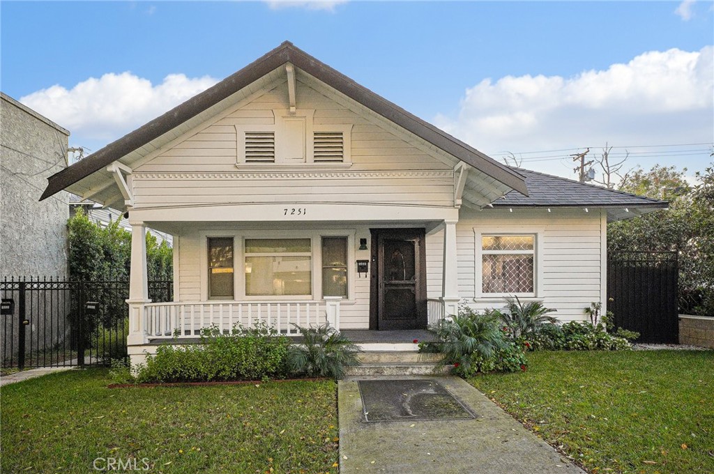 7251 Painter Avenue, Unit 7255 Whittier, CA 90602 - Photo 4 of 56 a front view of a house with garden