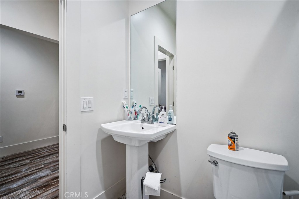 7251 Painter Avenue, Unit 7255 Whittier, CA 90602 - Photo 45 of 56 a bathroom with a sink mirror and toilet