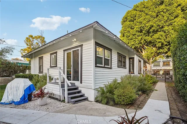 aerial view of a house with a yard and garden