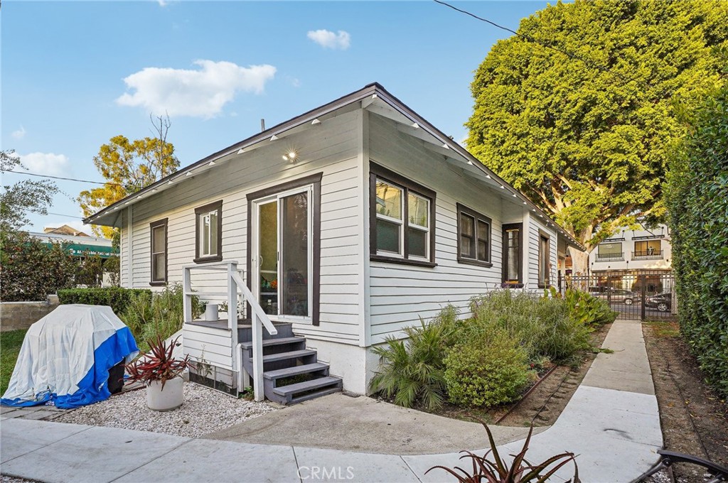 7251 Painter Avenue, Unit 7255 Whittier, CA 90602 - Photo 48 of 56 a front view of a house with garden