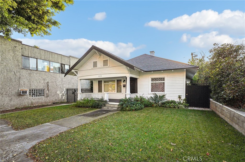 7251 Painter Avenue, Unit 7255 Whittier, CA 90602 - Photo 5 of 56 a front view of a house with a garden