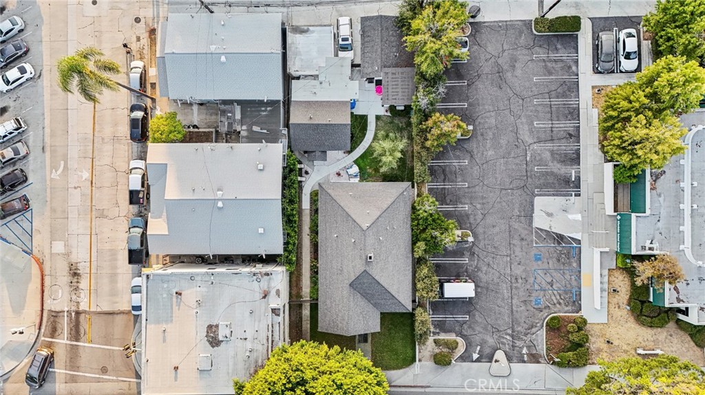 7251 Painter Avenue, Unit 7255 Whittier, CA 90602 - Photo 53 of 56 aerial view of a house with a yard and garden