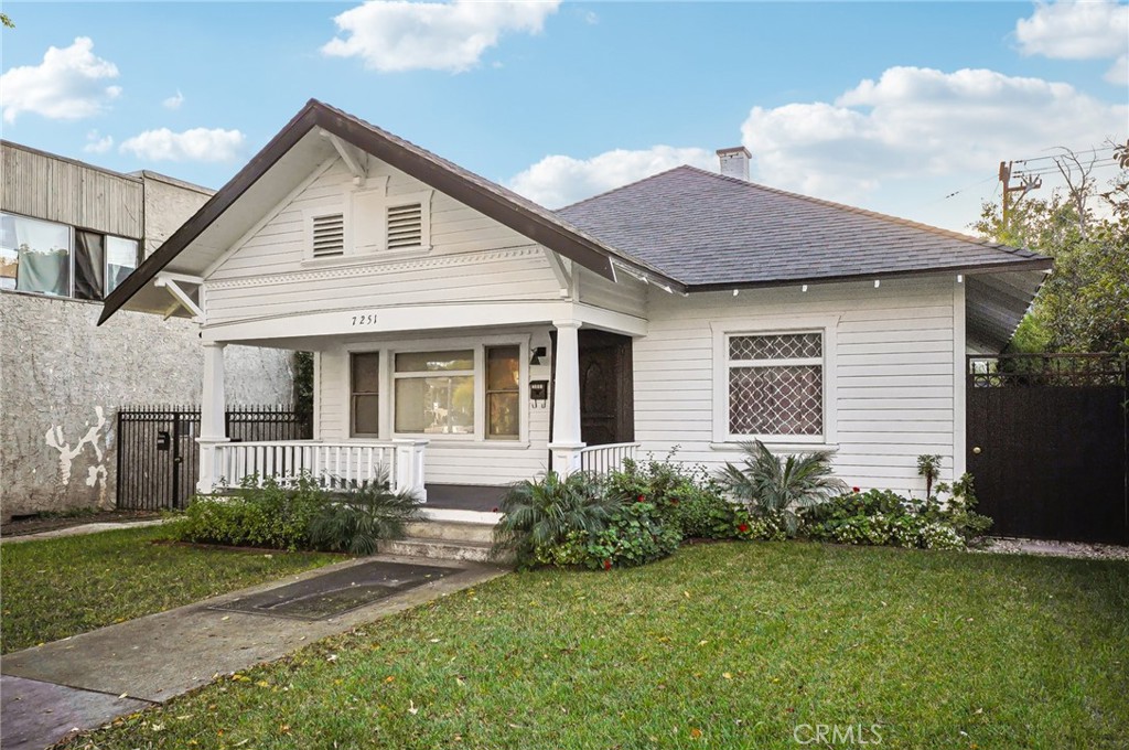 7251 Painter Avenue, Unit 7255 Whittier, CA 90602 - Photo 6 of 56 a view of a house with a yard plants and large tree