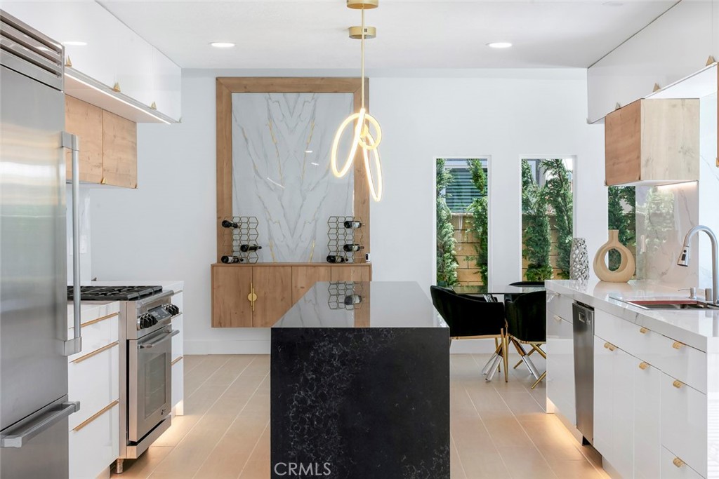 32232 Fall River Road Trabuco Canyon, CA 92679 - Photo 14 of 39 a room with a table chairs and a kitchen view