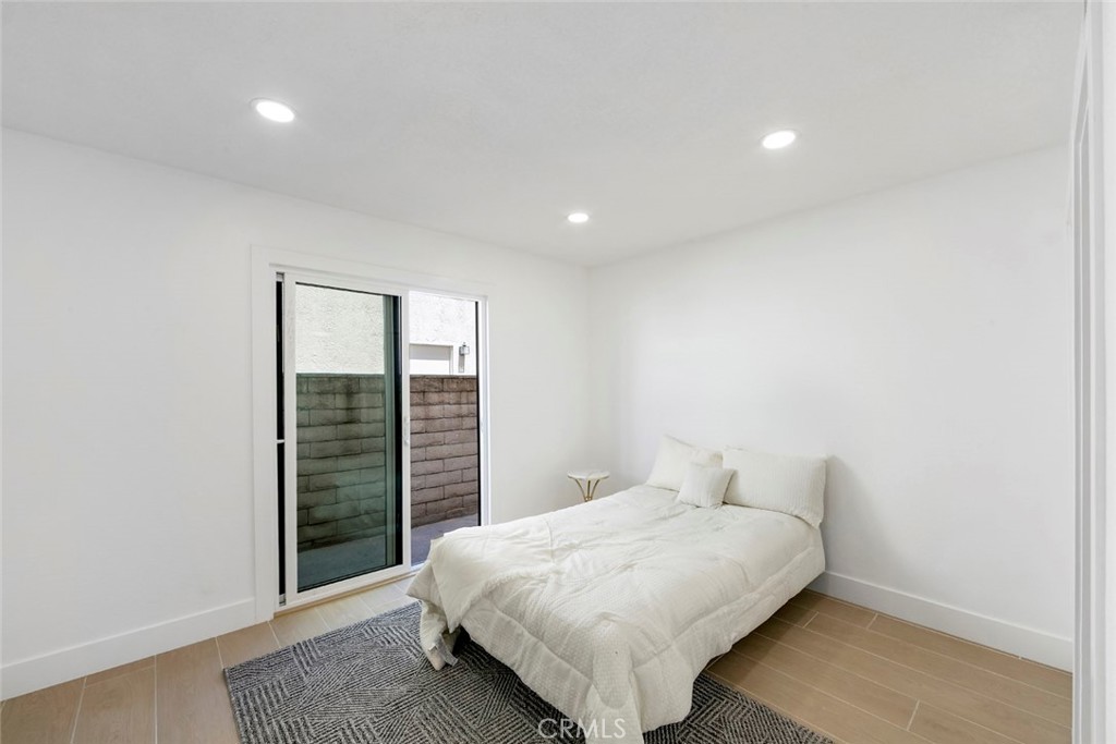 32232 Fall River Road Trabuco Canyon, CA 92679 - Photo 27 of 39 a spacious bedroom with a bed and a window
