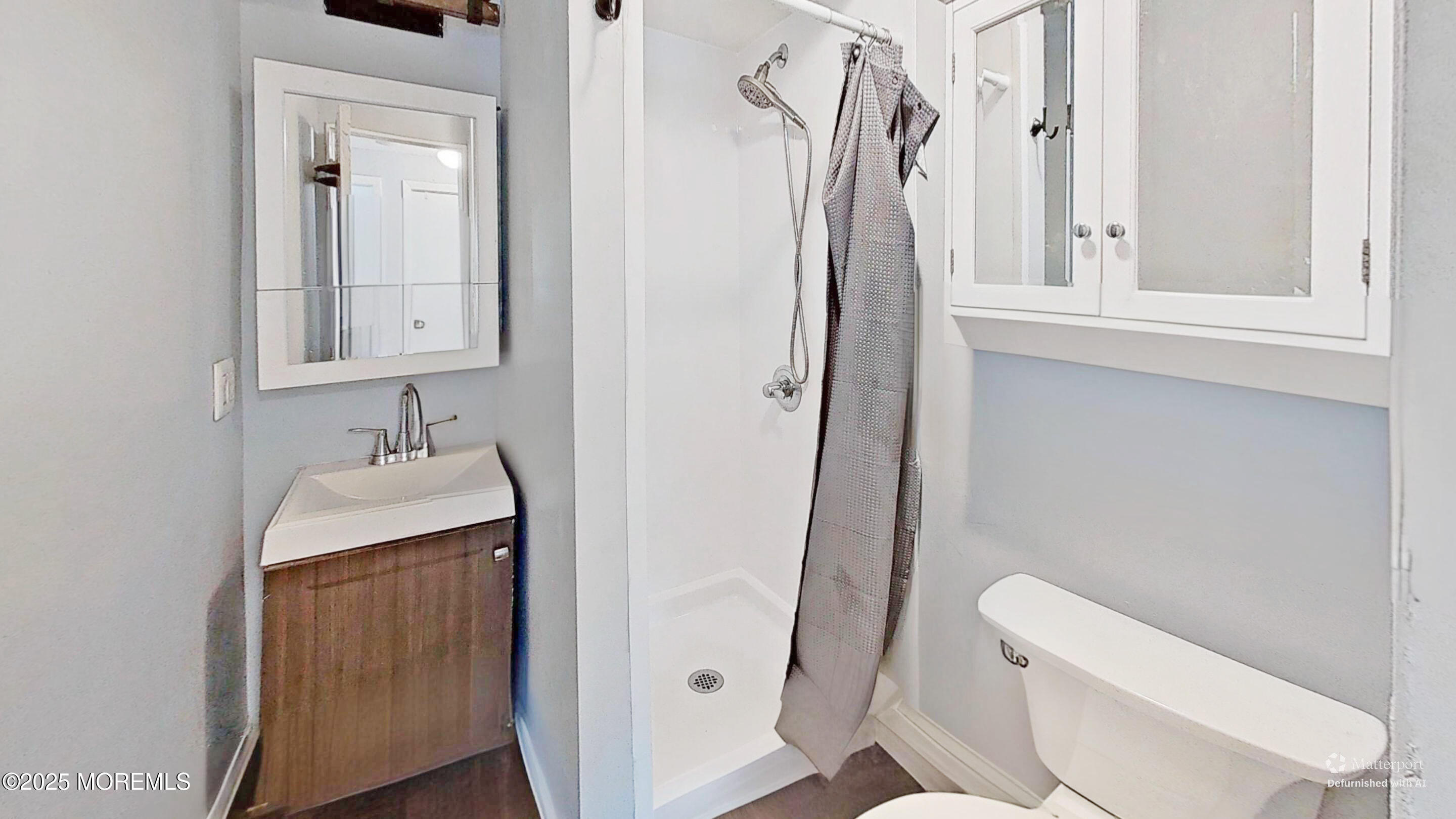 224 Sunset Lane Howell, NJ 07731 - Photo 13 of 23 a bathroom with a sink a toilet and shower