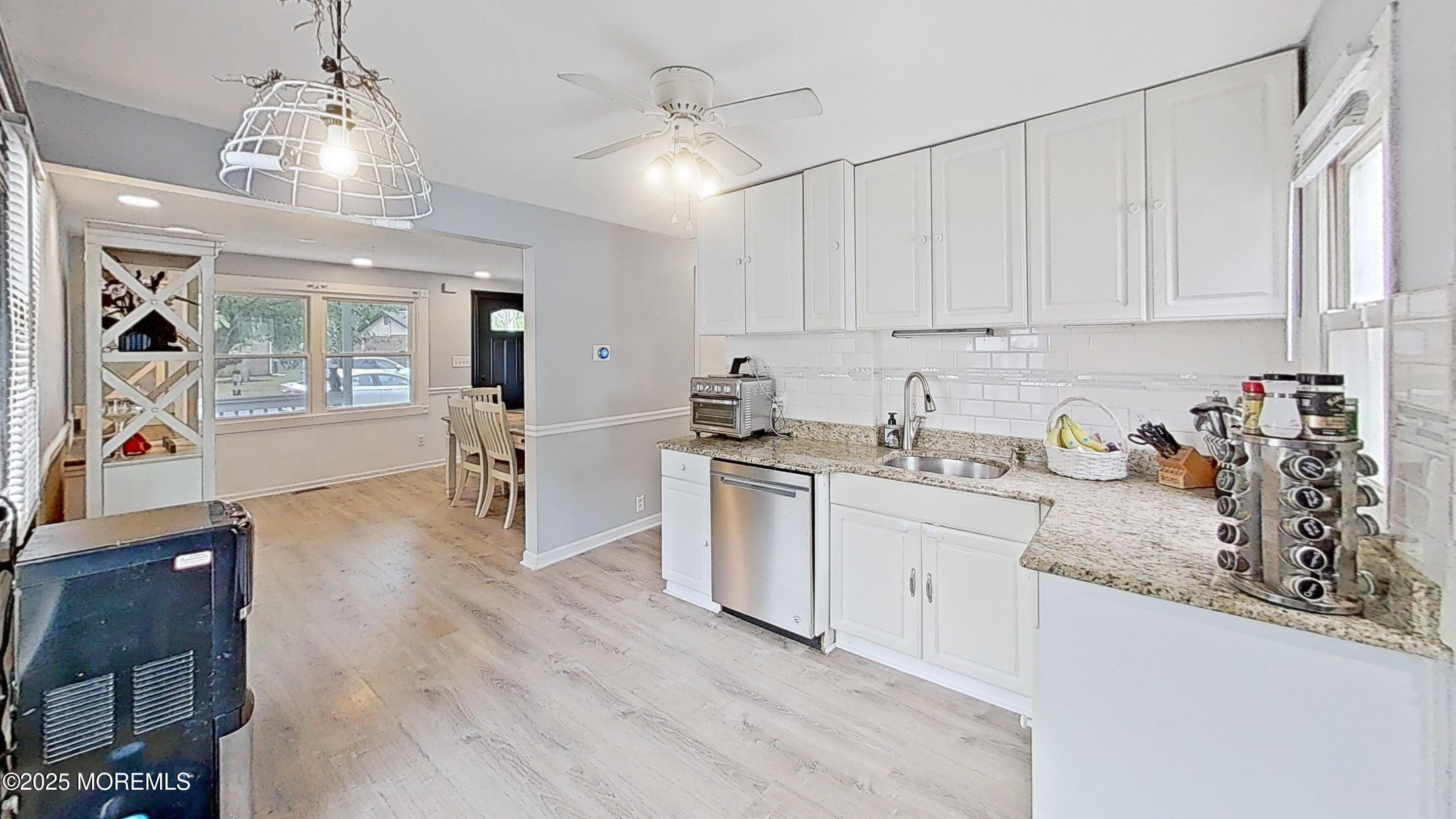 224 Sunset Lane Howell, NJ 07731 - Photo 14 of 23 a kitchen with granite countertop white cabinets and white appliances