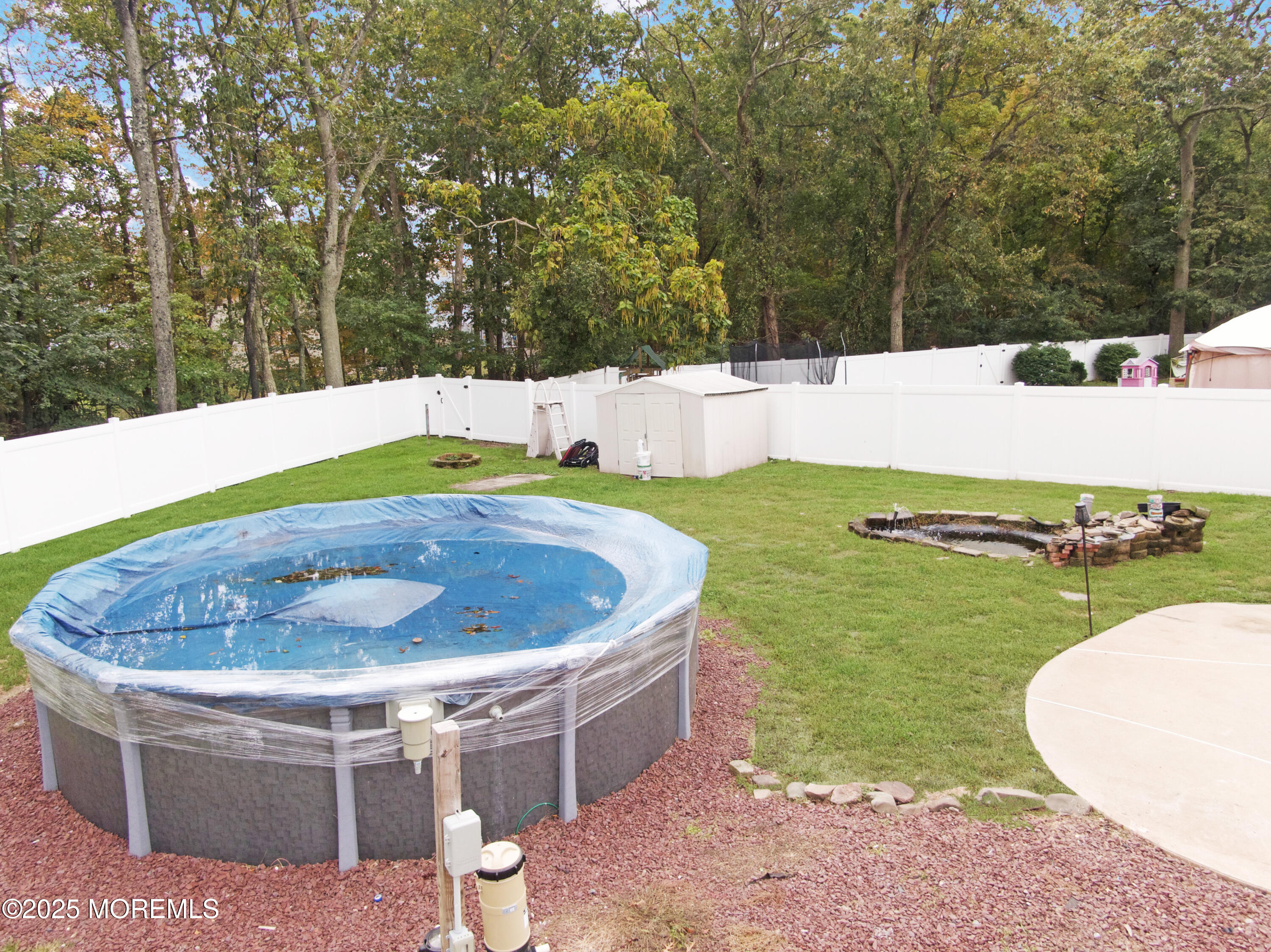224 Sunset Lane Howell, NJ 07731 - Photo 21 of 23 a view of a swimming pool with a backyard