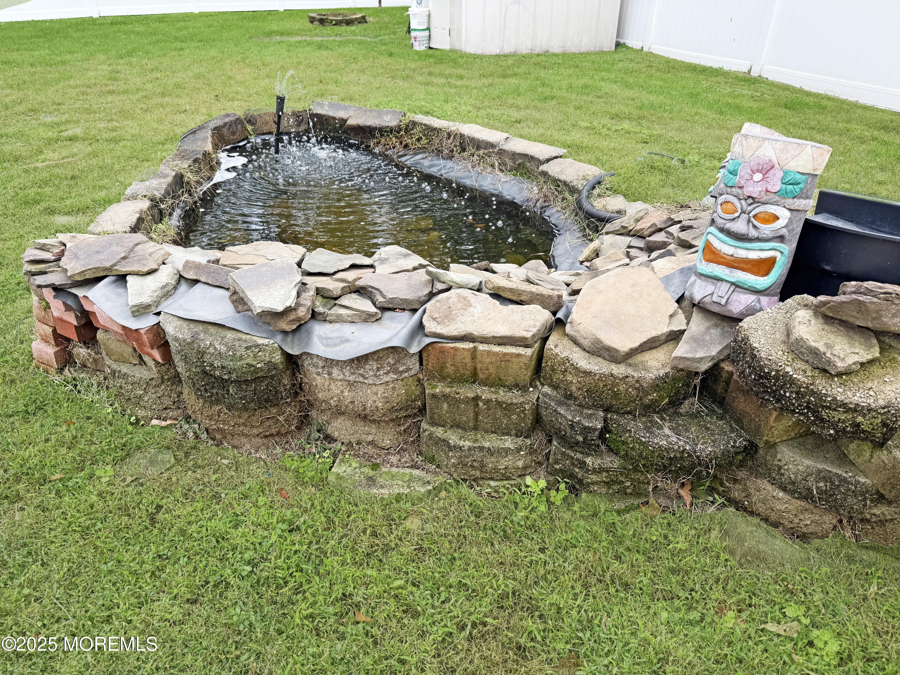 224 Sunset Lane Howell, NJ 07731 - Photo 22 of 23 a view of a table and chairs in the garden