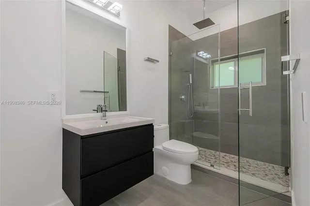 an empty room with windows and entrance