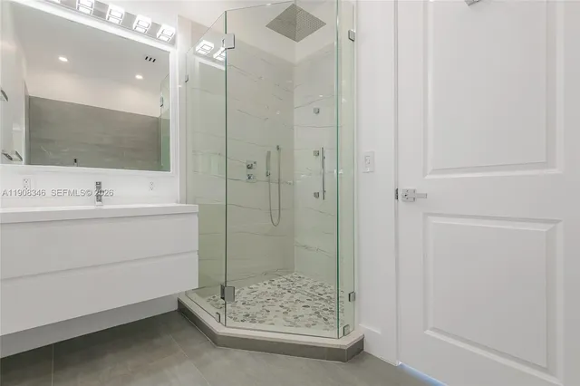 a white bath tub sitting next to a white toilet