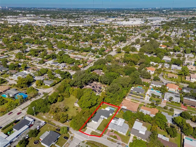 a view of a kitchen with a table and chairs