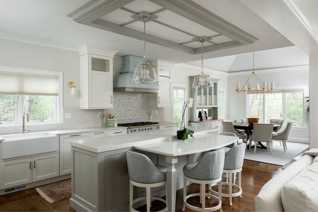155 Black Rock Drive, Unit 155 Hingham, MA 02043 - Photo 11 of 42 a kitchen with a dining table chairs cabinets and stainless steel appliances