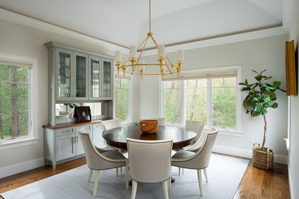 155 Black Rock Drive, Unit 155 Hingham, MA 02043 - Photo 15 of 42 a dining room with furniture window and wooden floor