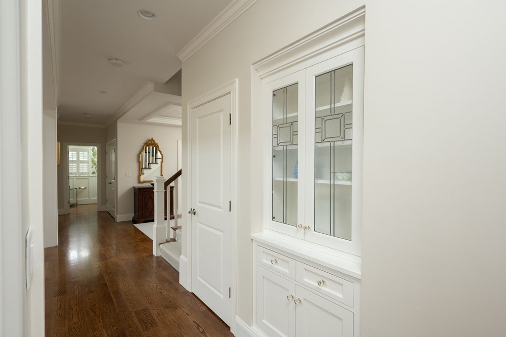 155 Black Rock Drive, Unit 155 Hingham, MA 02043 - Photo 17 of 42 a view of a hallway with wooden floor and staircase