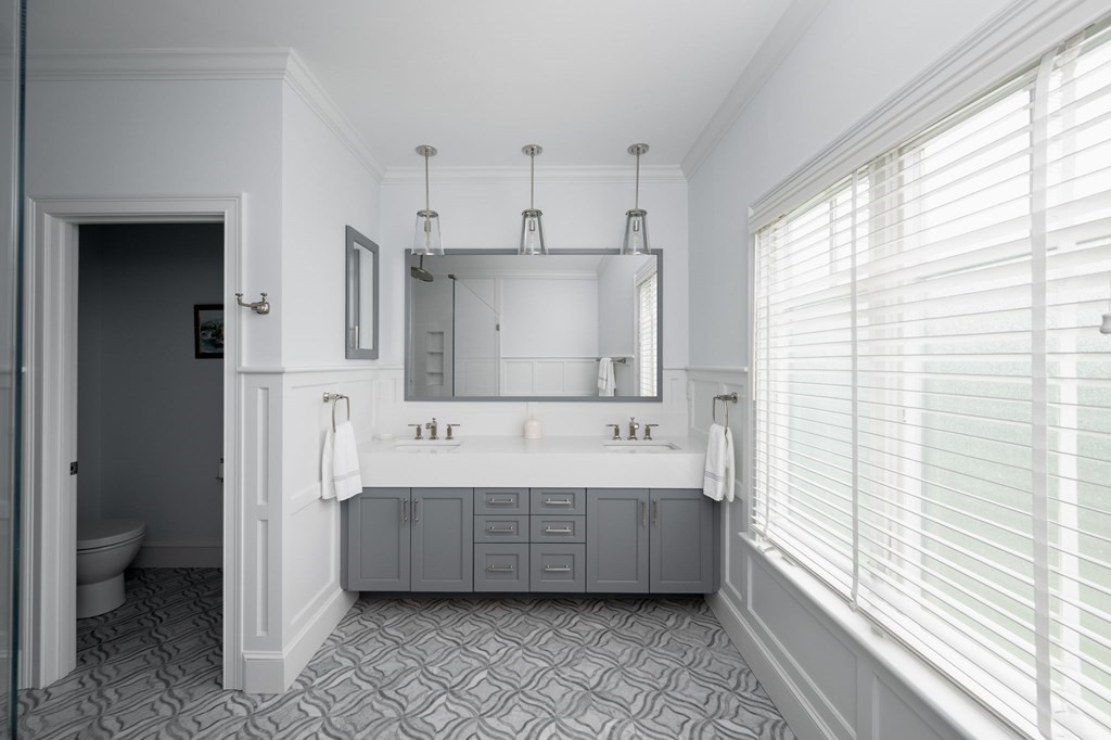 155 Black Rock Drive, Unit 155 Hingham, MA 02043 - Photo 23 of 42 a bathroom with a tub sink and mirror
