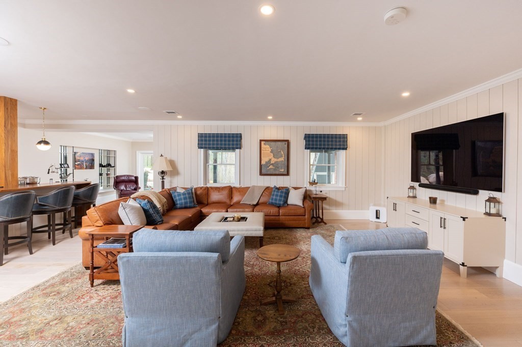 155 Black Rock Drive, Unit 155 Hingham, MA 02043 - Photo 30 of 42 a living room with furniture and a flat screen tv