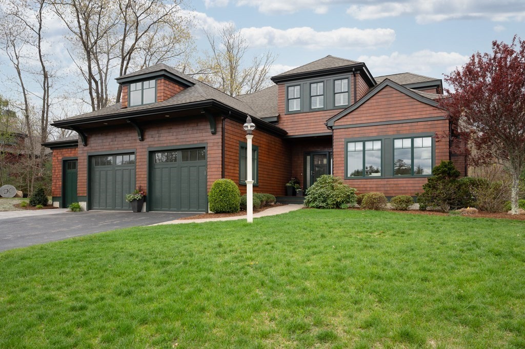 155 Black Rock Drive, Unit 155 Hingham, MA 02043 - Photo 40 of 42 a front view of a house with a garden and plants