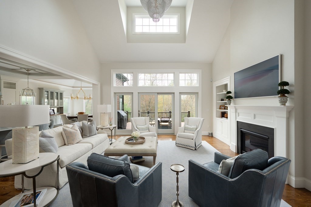 155 Black Rock Drive, Unit 155 Hingham, MA 02043 - Photo 4 of 42 a living room with furniture a fireplace and a flat screen tv