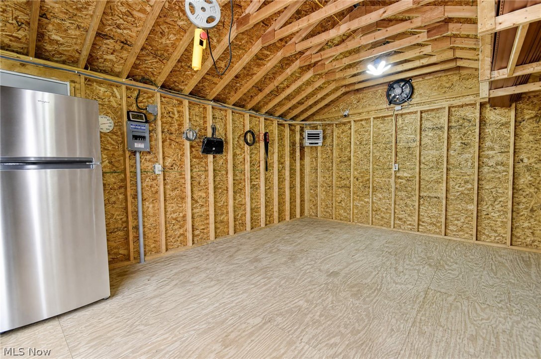 3864 State Road South Ashtabula, OH 44004 - Photo 39 of 50 Exposed wood framing, durable wood-finish flooring, and ample overhead lighting
