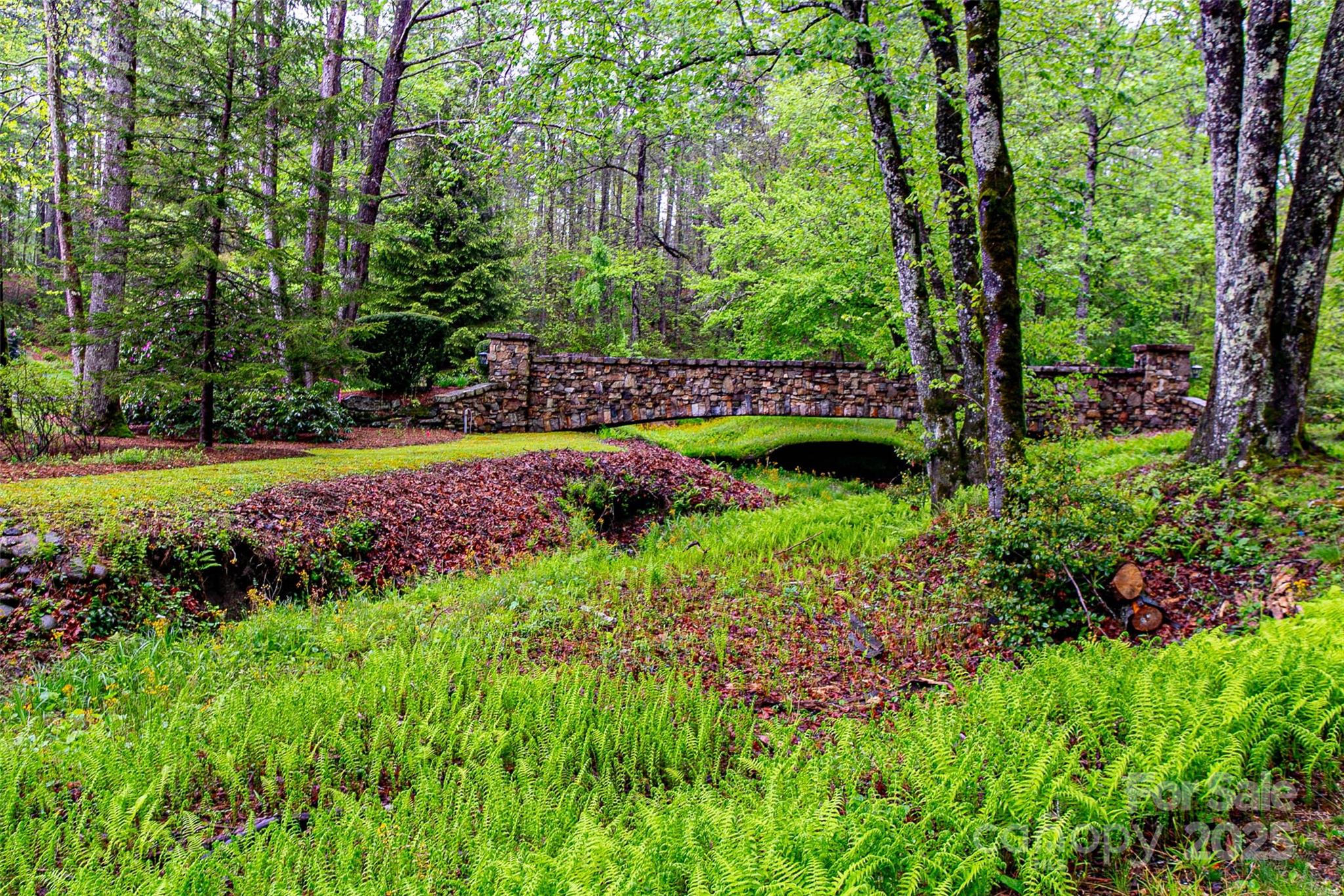 Tbd High Hemlock Trail, Unit 46 Brevard, NC 28712 - Photo 18 of 21 a view of a garden with flowers