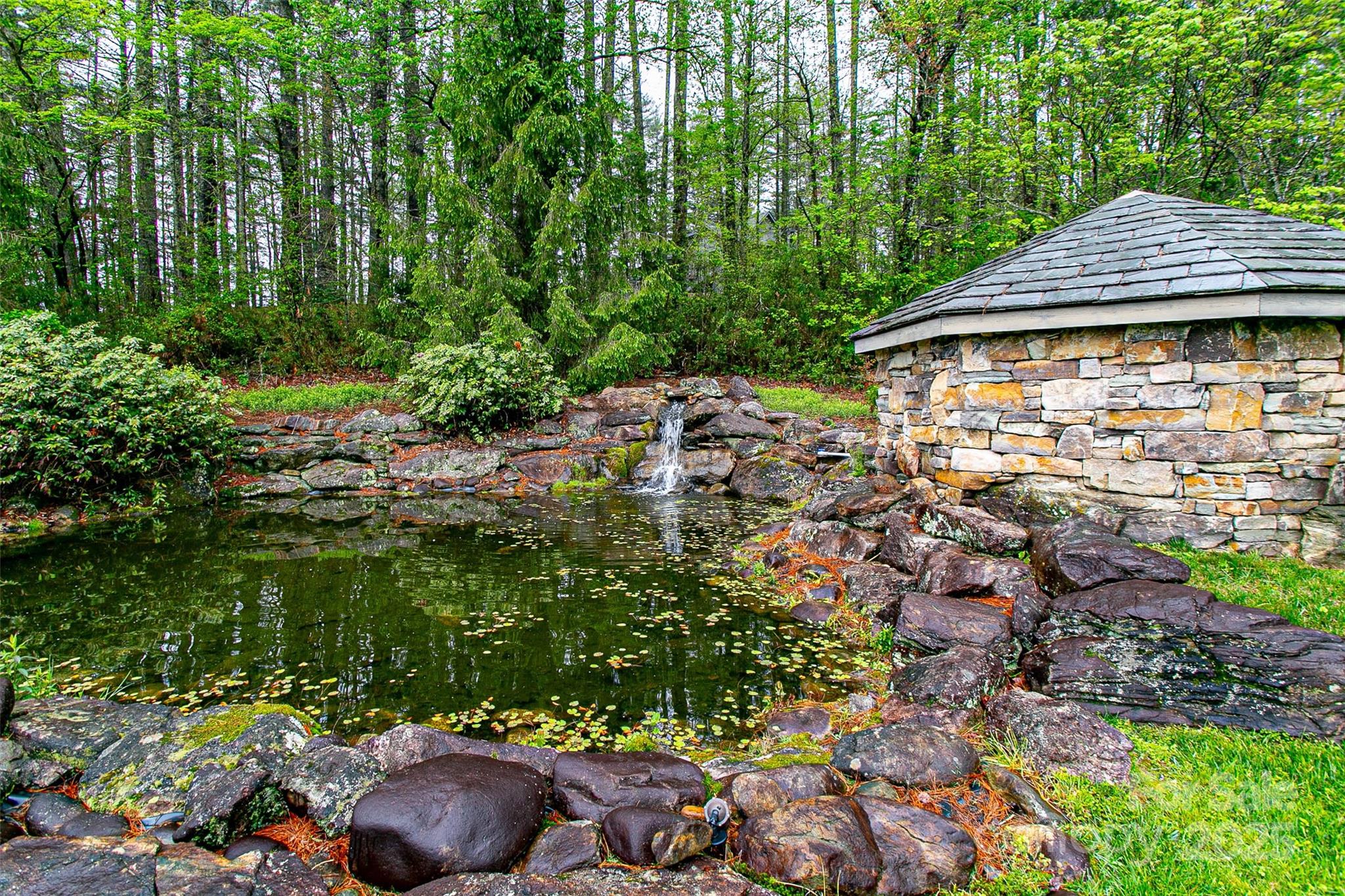 Tbd High Hemlock Trail, Unit 46 Brevard, NC 28712 - Photo 21 of 21 a backyard of a house with lots of green space