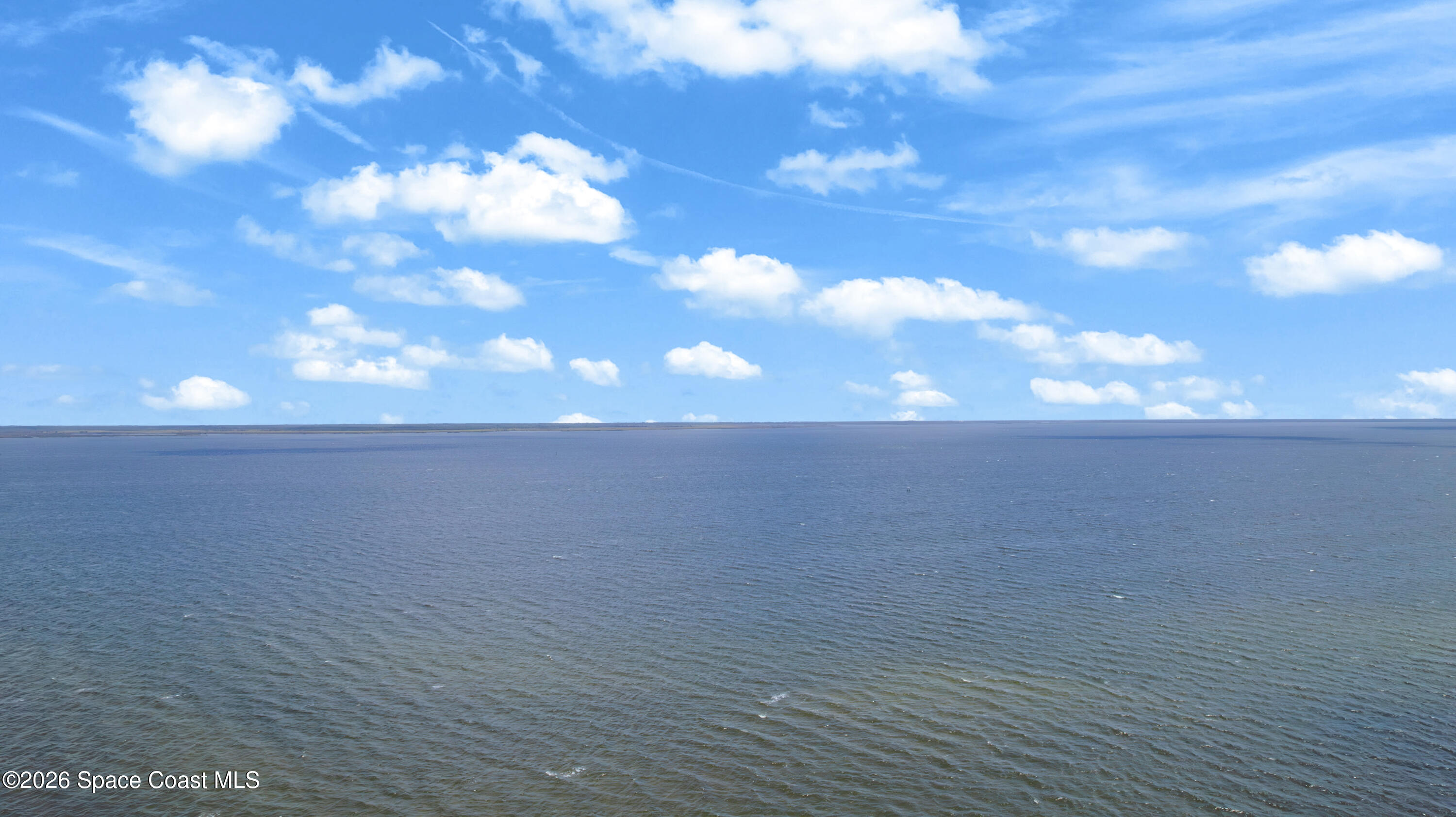1805 Riverside Drive, Unit 506 Titusville, FL 32780 - Photo 22 of 24 a view of beach and city