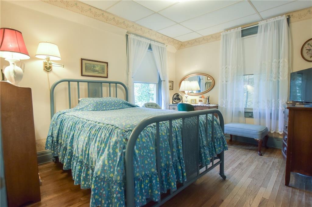 315 4th Street Freeport, PA 16229 - Photo 9 of 17 a bedroom with a bed mirror and a window